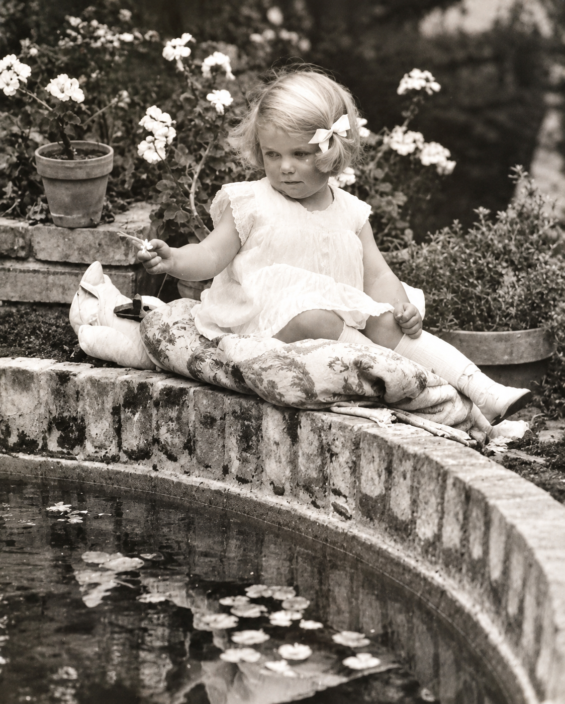 Patricia Ford beside the pond at the Pebble Beach house.